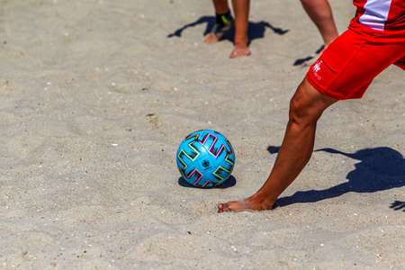 Odessa, Ukraine-July 25, 2020: Beach Soccer Championship among amateur women on beach. Soccer in sand. Young beautiful girls playing beach football on sand of city beach. Football on sandのeditorial素材