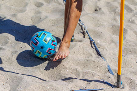 Odessa, Ukraine-July 25, 2020: Beach Soccer Championship among amateur women on beach. Soccer in sand. Young beautiful girls playing beach football on sand of city beach. Football on sandのeditorial素材