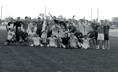 ODESSA, UKRAINE -13 August 2020: Ukrainian football championship among teams of first league White BALKANS (Zarya) Yellow - INGULETS (Pyatikhatka, Donetsk). BALKANA footballers celebrate victoryのeditorial素材