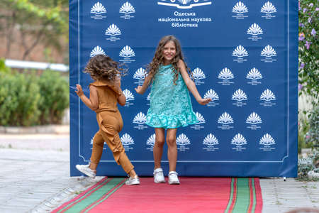 Odessa, Ukraine - CIRCA 2020: Children's Fashion Show. Presentation of young models in fashionable clothes on the red carpet defile. Models walk the runway at the presentation of the collectionのeditorial素材