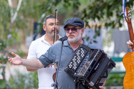 Odessa, Ukraine - CIRCA 2020: Home concert of street musicians in the courtyard of a house during the virus epidemic. Street musicians give a concert in the open airのeditorial素材