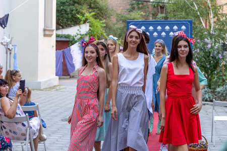 Odessa, Ukraine - CIRCA 2020: Children's Fashion Show. Presentation of young models in fashionable clothes on the red carpet defile. Models walk the runway at the presentation of the collectionのeditorial素材