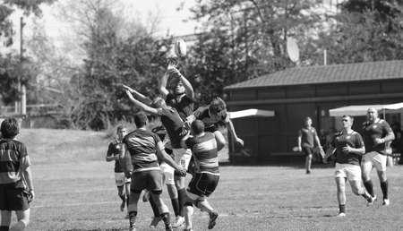 ODESSA, UKRAINE - SEPTEMBER 12, 2020: Final games of strongest rugby-7 teams in Ukrainian championship. Rugby ball on field. Rugby match is tough fight for ball. Athletes team players on fieldのeditorial素材