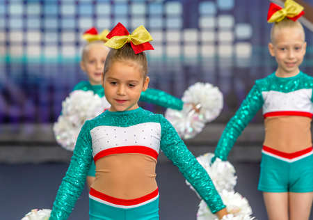 ODESSA, UKRAINE - September 20, 2020: Children's Cheerleading Championship. Young cheerleaders perform at the city's cheerleading championship in the gym. Children's sports, healthy lifestyleのeditorial素材