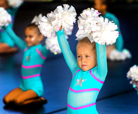 ODESSA, UKRAINE - September 20, 2020: Children's Cheerleading Championship. Young cheerleaders perform at the city's cheerleading championship in the gym. Children's sports, healthy lifestyleのeditorial素材