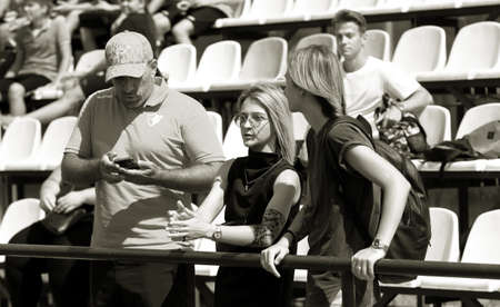 ODESSA, UKRAINE - CIRCUS, 2020: Spectators in the stands of a small rugby stadium as their favorite...