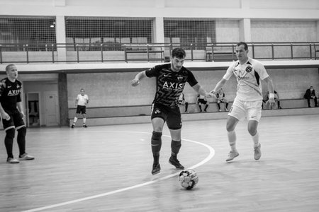 ODESSA, UKRAINE - 11/28/2020: MFC PRODEXIM (UKR) FUTSAL Champions League (Kherson) -white- ROSARIO (Northern Ireland) -blue. Highlights. PRODEXIM 28-1 Rosario Futsal Club. Mini-football on parquetのeditorial素材