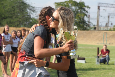 Odessa, Ukraine - August 22, 2020: Ukrainian Cup among women rugby teams. Winner's reward ceremony. Joyful moments with cup and medals. Victory of emotions of happiness among beautiful girls athletesのeditorial素材