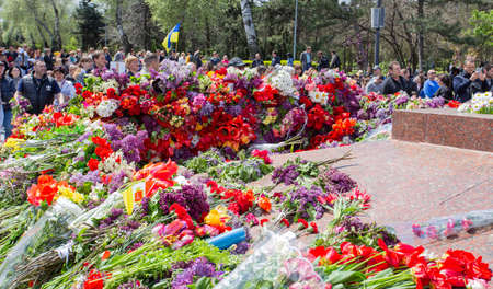 ODESSA, UKRAINE - MAY 9, 2021: Memorial of Unknown Sailor of Eternal Flame to defenders of Fatherland with flowers by fire. "Eternal Flame" in memorial to fallen defenders of Fatherland. Victory Dayのeditorial素材
