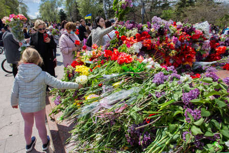 ODESSA, UKRAINE - MAY 9, 2021: Memorial of Unknown Sailor of Eternal Flame to defenders of Fatherland with flowers by fire. "Eternal Flame" in memorial to fallen defenders of Fatherland. Victory Dayのeditorial素材