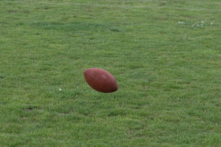 ODESSA, UKRAINE - May 30, 2021: American football on the grass. A tough duel, a battle between...