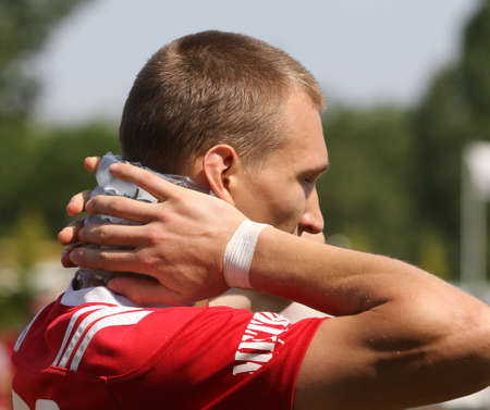 Odessa, Ukraine - June 23, 2021: Odessa National Team CREDO (red) - OLYMP-Kharkiv (yellow) in rugby 7s. Sharp aggressive fight of male rugby players for ball. Dynamic play on green grass of stadiumのeditorial素材