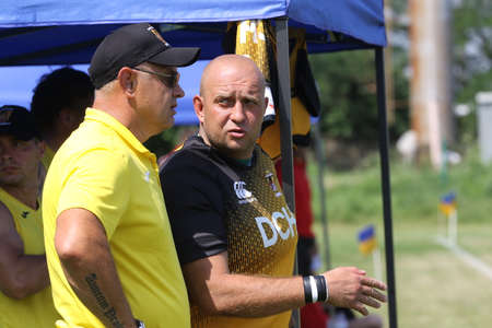 Odessa, Ukraine - June 23, 2021: Odessa national team CREDO (red) - OLYMP Kharkiv (yellow) rugby-7. Valeriy Kochanov - head coach of OLYMP rugby club - Kharkiv - coach of national team of Ukraineのeditorial素材