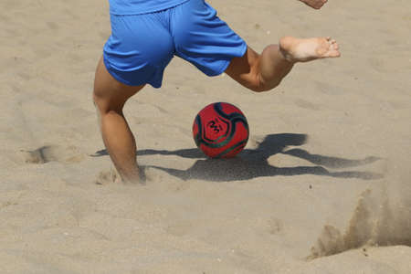 ODESSA, UKRAINE July 8, 2021: Ukrainian Beach Soccer Women's Cup. The girl's footballers are desperately playing beach soccer on sand of sea city beach on a hot sunny day. Women's soccer on sandのeditorial素材