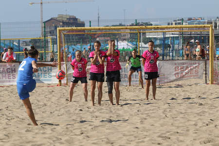 ODESSA, UKRAINE July 8, 2021: Ukrainian Beach Soccer Women's Cup. The girl's footballers are desperately playing beach soccer on sand of sea city beach on a hot sunny day. Women's soccer on sandのeditorial素材