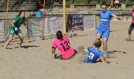 ODESSA, UKRAINE July 8, 2021: Ukrainian Beach Soccer Women's Cup. The girl's footballers are desperately playing beach soccer on sand of sea city beach on a hot sunny day. Women's soccer on sandのeditorial素材
