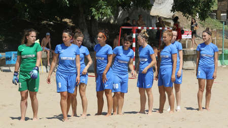 ODESSA, UKRAINE July 8, 2021: Ukrainian Beach Soccer Women's Cup. The girl's footballers are desperately playing beach soccer on sand of sea city beach on a hot sunny day. Women's soccer on sandのeditorial素材