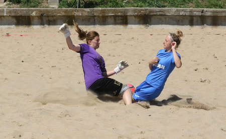 ODESSA, UKRAINE July 8, 2021: Ukrainian Beach Soccer Women's Cup. The girl's footballers are desperately playing beach soccer on sand of sea city beach on a hot sunny day. Women's soccer on sandのeditorial素材