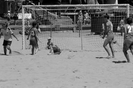 ODESSA, UKRAINE July 8, 2021: Ukrainian Beach Soccer Women's Cup. The girl's footballers are desperately playing beach soccer on sand of sea city beach on a hot sunny day. Women's soccer on sandのeditorial素材