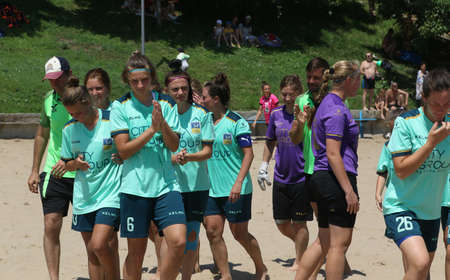 ODESSA, UKRAINE July 8, 2021: Ukrainian Beach Soccer Women's Cup. The girl's footballers are desperately playing beach soccer on sand of sea city beach on a hot sunny day. Women's soccer on sandのeditorial素材