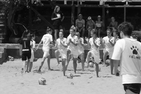 ODESSA, UKRAINE July 8, 2021: Ukrainian Beach Soccer Women's Cup. The girl's footballers are desperately playing beach soccer on sand of sea city beach on a hot sunny day. Women's soccer on sandのeditorial素材