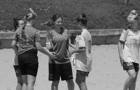 ODESSA, UKRAINE July 8, 2021: Ukrainian Beach Soccer Women's Cup. The girl's footballers are desperately playing beach soccer on sand of sea city beach on a hot sunny day. Women's soccer on sandのeditorial素材
