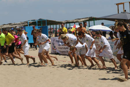 ODESSA, UKRAINE July 8, 2021: Ukrainian Beach Soccer Women's Cup. The girl's footballers are desperately playing beach soccer on sand of sea city beach on a hot sunny day. Women's soccer on sandのeditorial素材