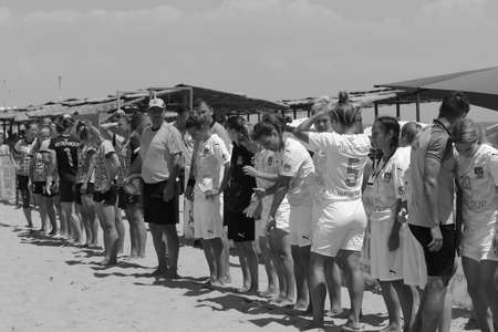 ODESSA, UKRAINE July 8, 2021: Ukrainian Beach Soccer Women's Cup. The girl's footballers are desperately playing beach soccer on sand of sea city beach on a hot sunny day. Women's soccer on sandのeditorial素材