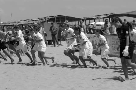 ODESSA, UKRAINE July 8, 2021: Ukrainian Beach Soccer Women's Cup. The girl's footballers are desperately playing beach soccer on sand of sea city beach on a hot sunny day. Women's soccer on sandのeditorial素材