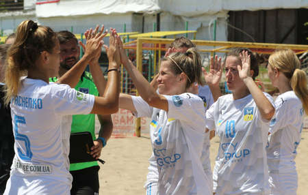 ODESSA, UKRAINE July 8, 2021: Ukrainian Beach Soccer Women's Cup. The girl's footballers are desperately playing beach soccer on sand of sea city beach on a hot sunny day. Women's soccer on sandのeditorial素材