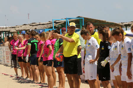 ODESSA, UKRAINE July 8, 2021: Ukrainian Beach Soccer Women's Cup. The girl's footballers are desperately playing beach soccer on sand of sea city beach on a hot sunny day. Women's soccer on sandのeditorial素材