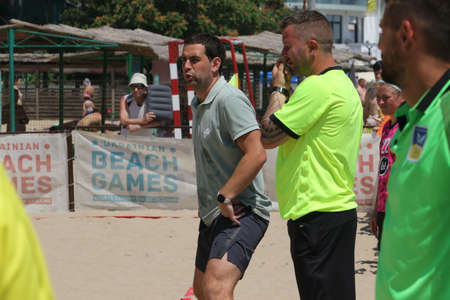 ODESSA, UKRAINE July 8, 2021: Ukrainian Beach Soccer Women's Cup. The girl's footballers are desperately playing beach soccer on sand of sea city beach on a hot sunny day. Women's soccer on sandのeditorial素材