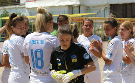 ODESSA, UKRAINE July 8, 2021: Ukrainian Beach Soccer Women's Cup. The girl's footballers are desperately playing beach soccer on sand of sea city beach on a hot sunny day. Women's soccer on sandのeditorial素材