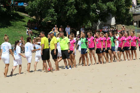 ODESSA, UKRAINE July 8, 2021: Ukrainian Beach Soccer Women's Cup. The girl's footballers are desperately playing beach soccer on sand of sea city beach on a hot sunny day. Women's soccer on sandのeditorial素材