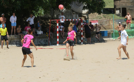 ODESSA, UKRAINE July 8, 2021: Ukrainian Beach Soccer Women's Cup. The girl's footballers are desperately playing beach soccer on sand of sea city beach on a hot sunny day. Women's soccer on sandのeditorial素材