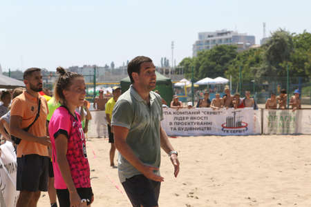 ODESSA, UKRAINE July 8, 2021: Ukrainian Beach Soccer Women's Cup. The girl's footballers are desperately playing beach soccer on sand of sea city beach on a hot sunny day. Women's soccer on sandのeditorial素材