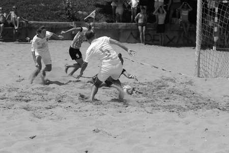ODESSA, UKRAINE July 8, 2021: Ukrainian Beach Soccer Women's Cup. The girl's footballers are desperately playing beach soccer on sand of sea city beach on a hot sunny day. Women's soccer on sandのeditorial素材