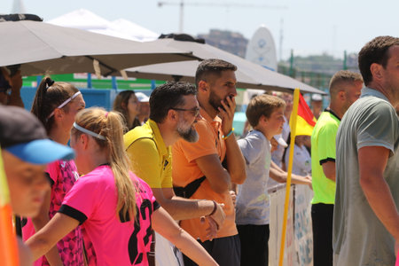 ODESSA, UKRAINE July 8, 2021: Ukrainian Beach Soccer Women's Cup. The girl's footballers are desperately playing beach soccer on sand of sea city beach on a hot sunny day. Women's soccer on sandのeditorial素材