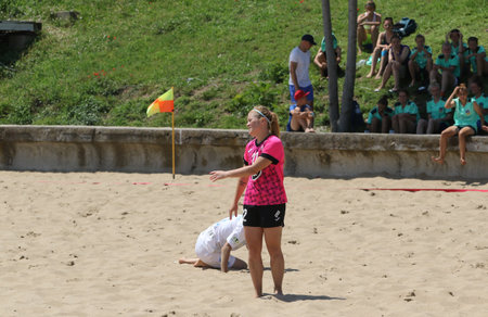 ODESSA, UKRAINE July 8, 2021: Ukrainian Beach Soccer Women's Cup. The girl's footballers are desperately playing beach soccer on sand of sea city beach on a hot sunny day. Women's soccer on sandのeditorial素材
