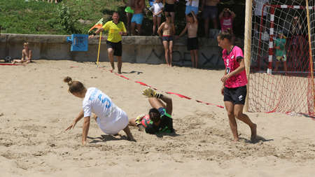 ODESSA, UKRAINE July 8, 2021: Ukrainian Beach Soccer Women's Cup. The girl's footballers are desperately playing beach soccer on sand of sea city beach on a hot sunny day. Women's soccer on sandのeditorial素材
