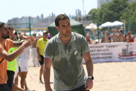 ODESSA, UKRAINE July 8, 2021: Ukrainian Beach Soccer Women's Cup. The girl's footballers are desperately playing beach soccer on sand of sea city beach on a hot sunny day. Women's soccer on sandのeditorial素材