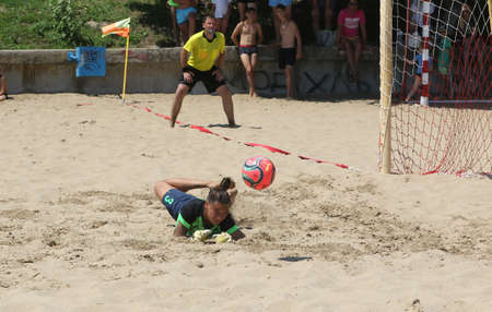 ODESSA, UKRAINE July 8, 2021: Ukrainian Beach Soccer Women's Cup. The girl's footballers are desperately playing beach soccer on sand of sea city beach on a hot sunny day. Women's soccer on sandのeditorial素材
