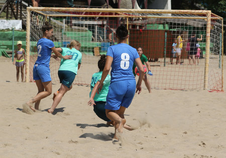 ODESSA, UKRAINE July 8, 2021: Ukrainian Beach Soccer Women's Cup. The girl's footballers are desperately playing beach soccer on sand of sea city beach on a hot sunny day. Women's soccer on sandのeditorial素材