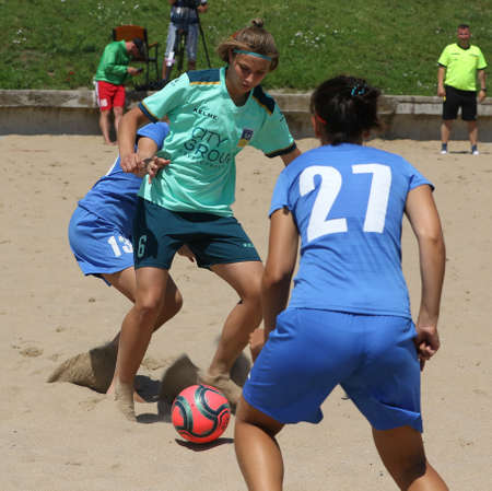 ODESSA, UKRAINE July 8, 2021: Ukrainian Beach Soccer Women's Cup. The girl's footballers are desperately playing beach soccer on sand of sea city beach on a hot sunny day. Women's soccer on sandのeditorial素材