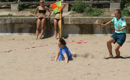 ODESSA, UKRAINE July 8, 2021: Ukrainian Beach Soccer Women's Cup. The girl's footballers are desperately playing beach soccer on sand of sea city beach on a hot sunny day. Women's soccer on sandのeditorial素材