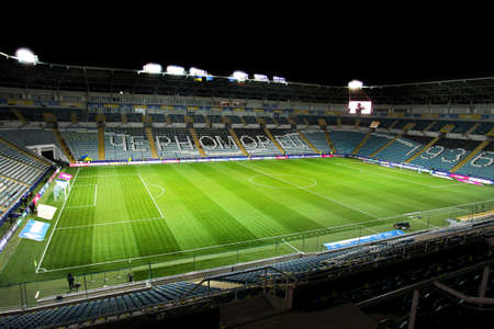 ODESSA, UKRAINE - November 11, 2021: ChMP Stadium before game between national teams of Ukraine and Bulgaria. Panoramic views of football arena with natural grass lawn for 36,000 spectators at nightのeditorial素材
