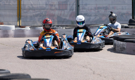 ODESSA, UKRAINE - August 7,2022: Extreme car racing. healthy lifestyle. Tense moments of race. People are into motorsports. Karting. Hobbies, sport, recreation, lifestyle. Risk and excitement on courtのeditorial素材