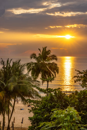 Very nice sunset over the sea at Surin Beach on the island of Phuket in Thailand.の写真素材