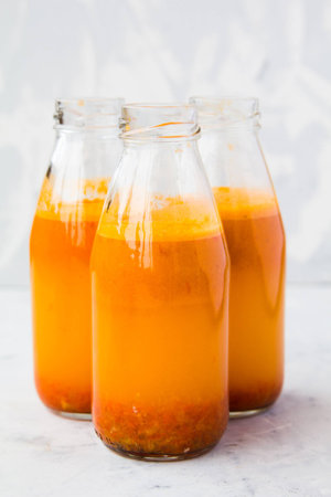 Bottles with orange juice