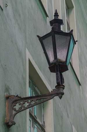 Old classic street lamp on front of houseの写真素材